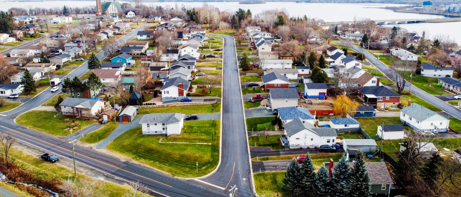 Aerial view of a residential neighbourhood in Bathurst, with the bay in the distance