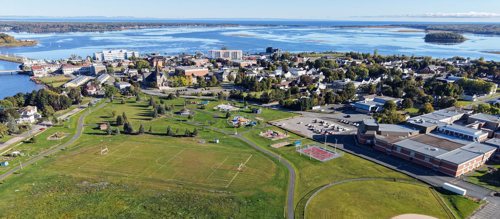 Aerial view of Bathurst, looking over the ball fields toward downtown and Chaleur Bay